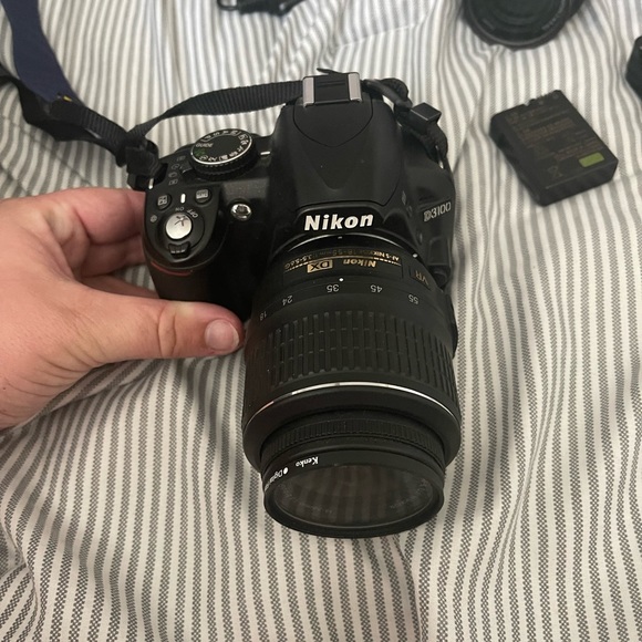Nikon Camera: 2 lenses2 battery(one 4 the wall & one for the car) strap bag.